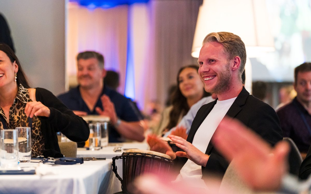Corporate participants taking part in an InRhythm interactive drumming experience